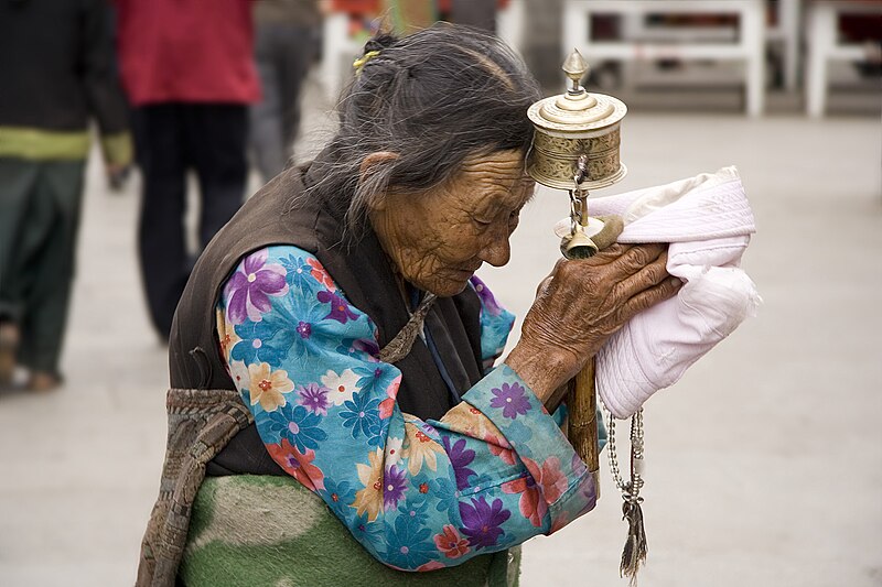 File:An elderly Tibetan women holding a prayer wheel on Lhasa, Barkhor.jpg