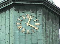 approx. 04:03 (or 16:03) displayed on clock/watch